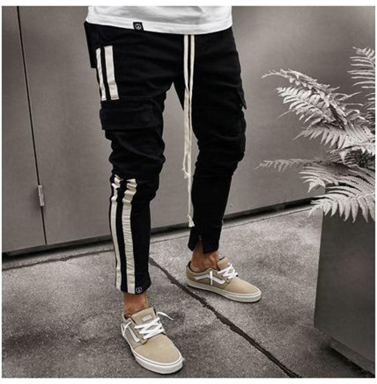 Camouflage men's slim-fit joggers with side stripes, elastic waist, ideal for sports and casual wear.