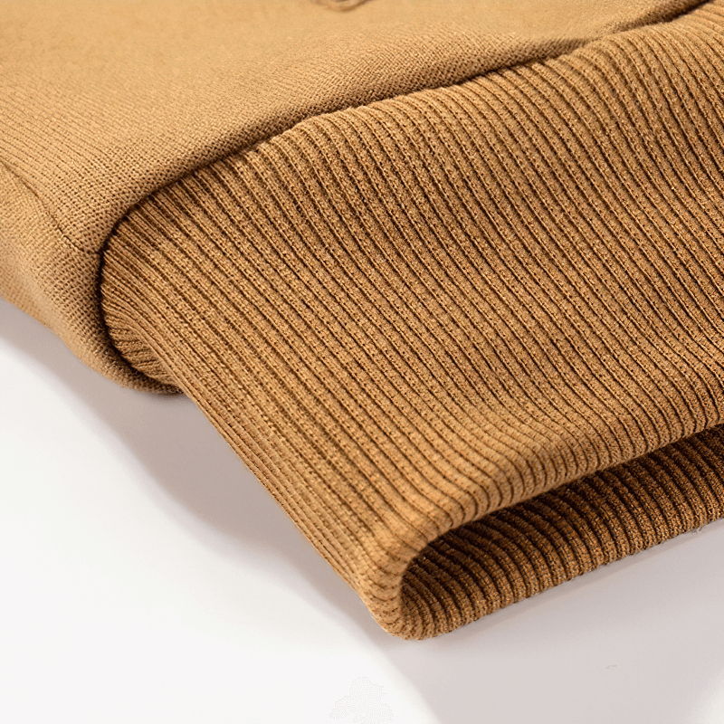 Close-up of the warm, ribbed cuff of a men's fleece camouflage hoodie in a stylish brown color.