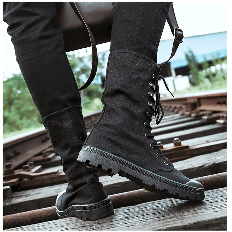 Stylish black canvas men lace-up boots with rugged soles, perfect for casual and tactical wear.