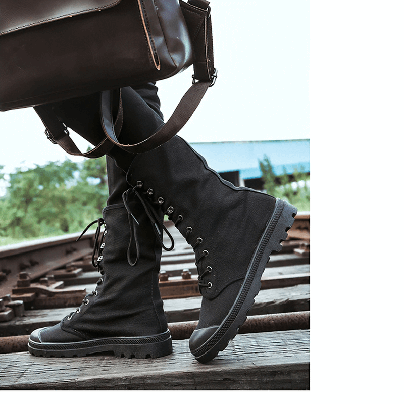 Men's canvas lace-up mid-calf military tactical boots in black, perfect for casual style and outdoor adventures.