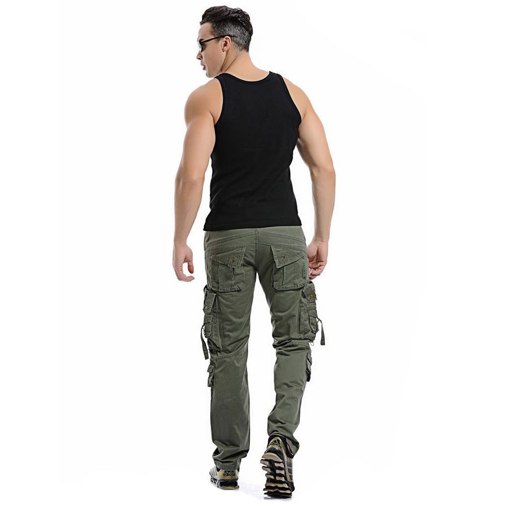 Man wearing army green cargo pants with big pockets, paired with a black tank top for a stylish military look.