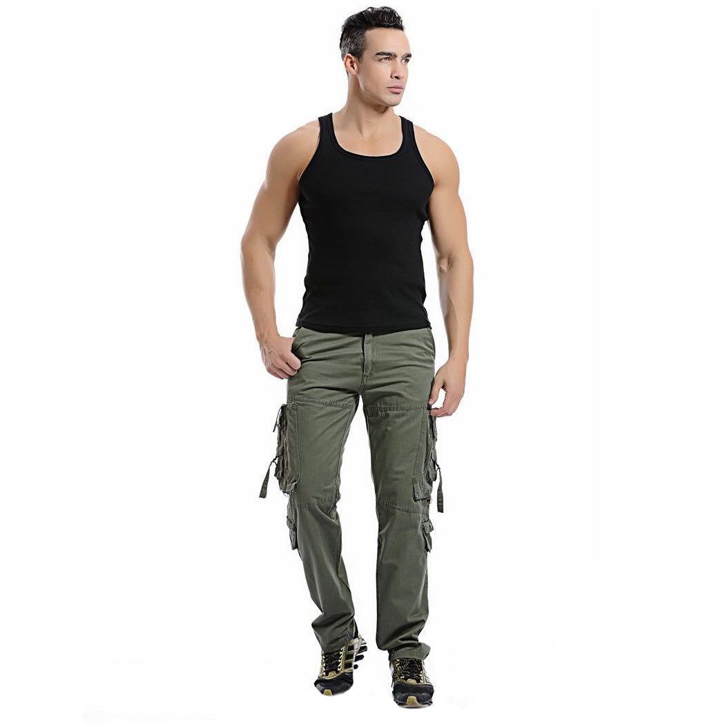 Men's army green cargo pants with big pockets, styled with a black tank top for a casual look.