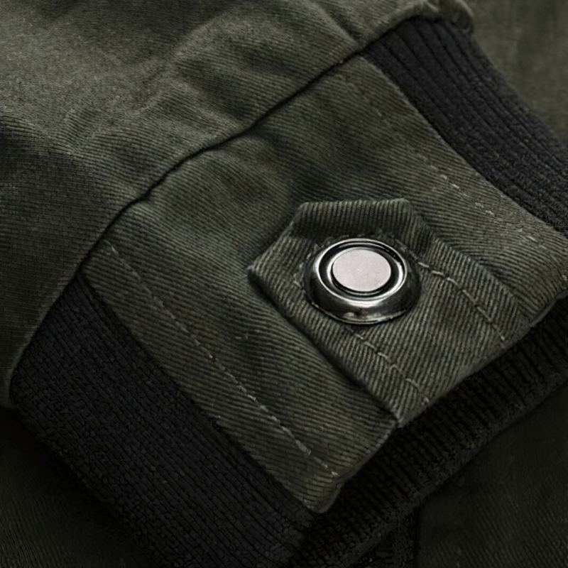 Close-up of the cuff detail on a men's army cotton bomber jacket, showcasing sturdy snap button and ribbed design.