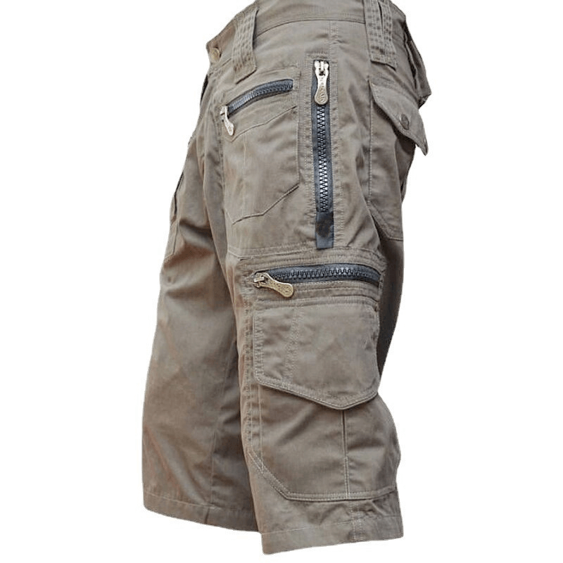 Side view of men's breathable multi pocket military shorts in stylish khaki fabric.