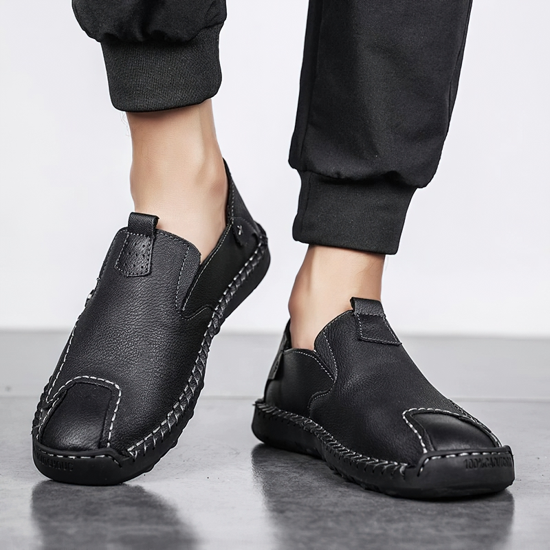 Stylish men's black PU leather loafers with flexible soles for comfortable casual wear.