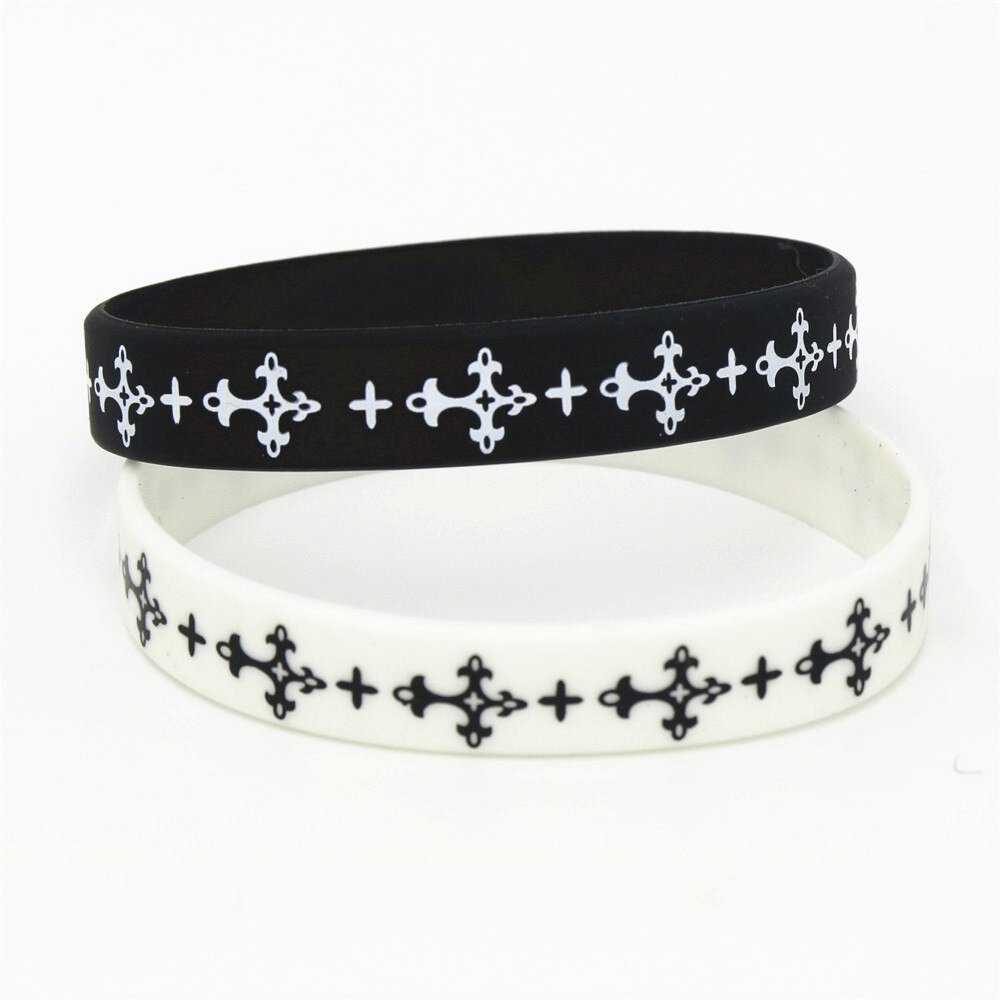 Black and white silicone fashion wristband set with stylish pattern. Perfect sports accessory for stylish looks.