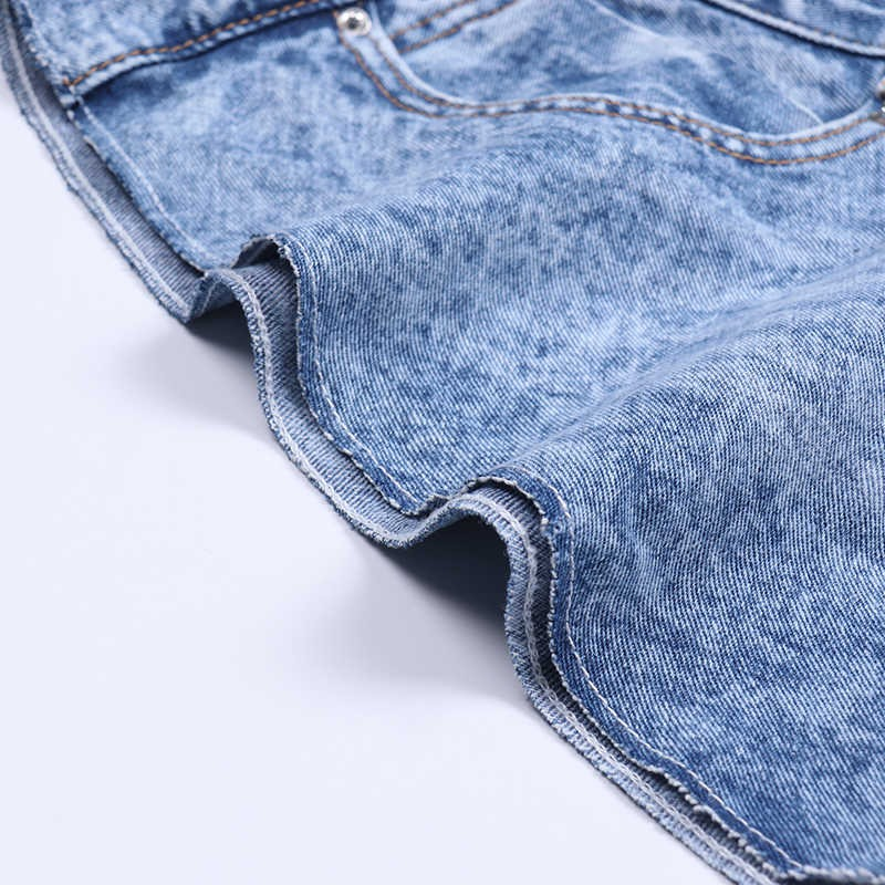 Close-up of casual denim shorts for women showcasing the hem and texture in a light blue shade.