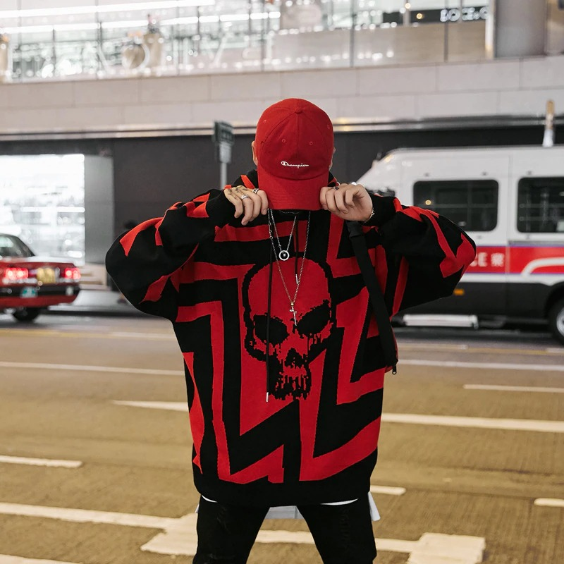 Trendy oversized men's hoodie with bold red skull print, perfect for casual streetwear style.