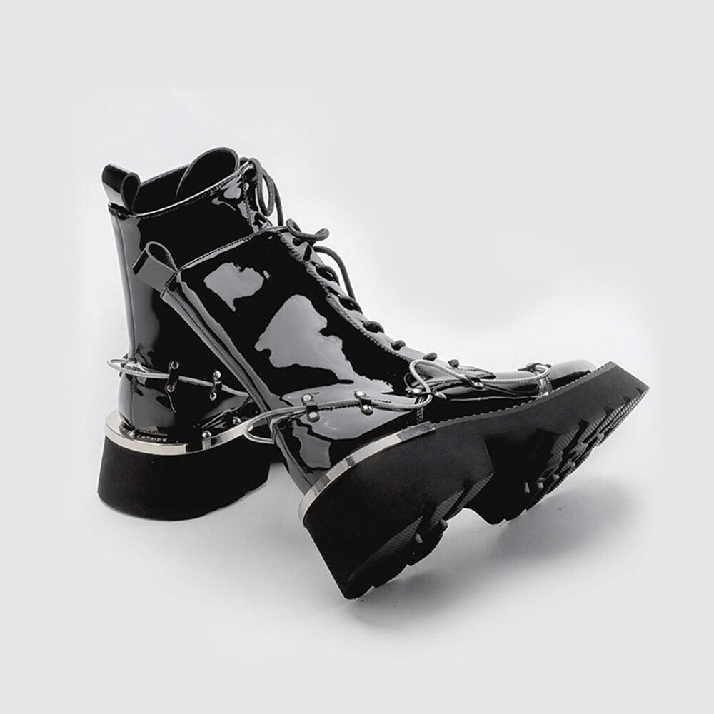 Glossy black lace-up Martin boots with square toe and stylish chains, perfect for trendy casual outfits.
