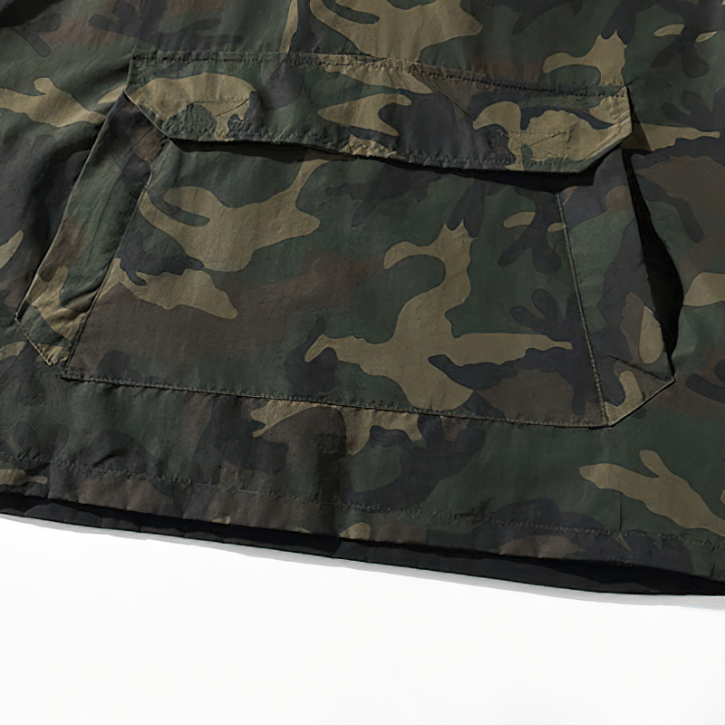 Close-up of camouflage pocket detail on a casual men's loose hoodie with stylish design.