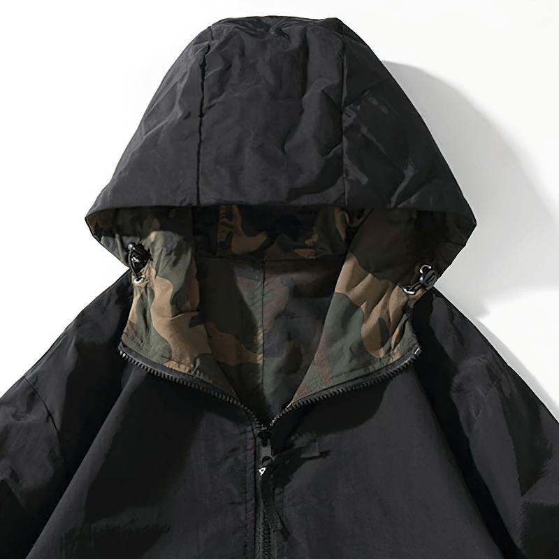 Men's black loose hoodie with camouflage lining, perfect for casual wear with modern style.