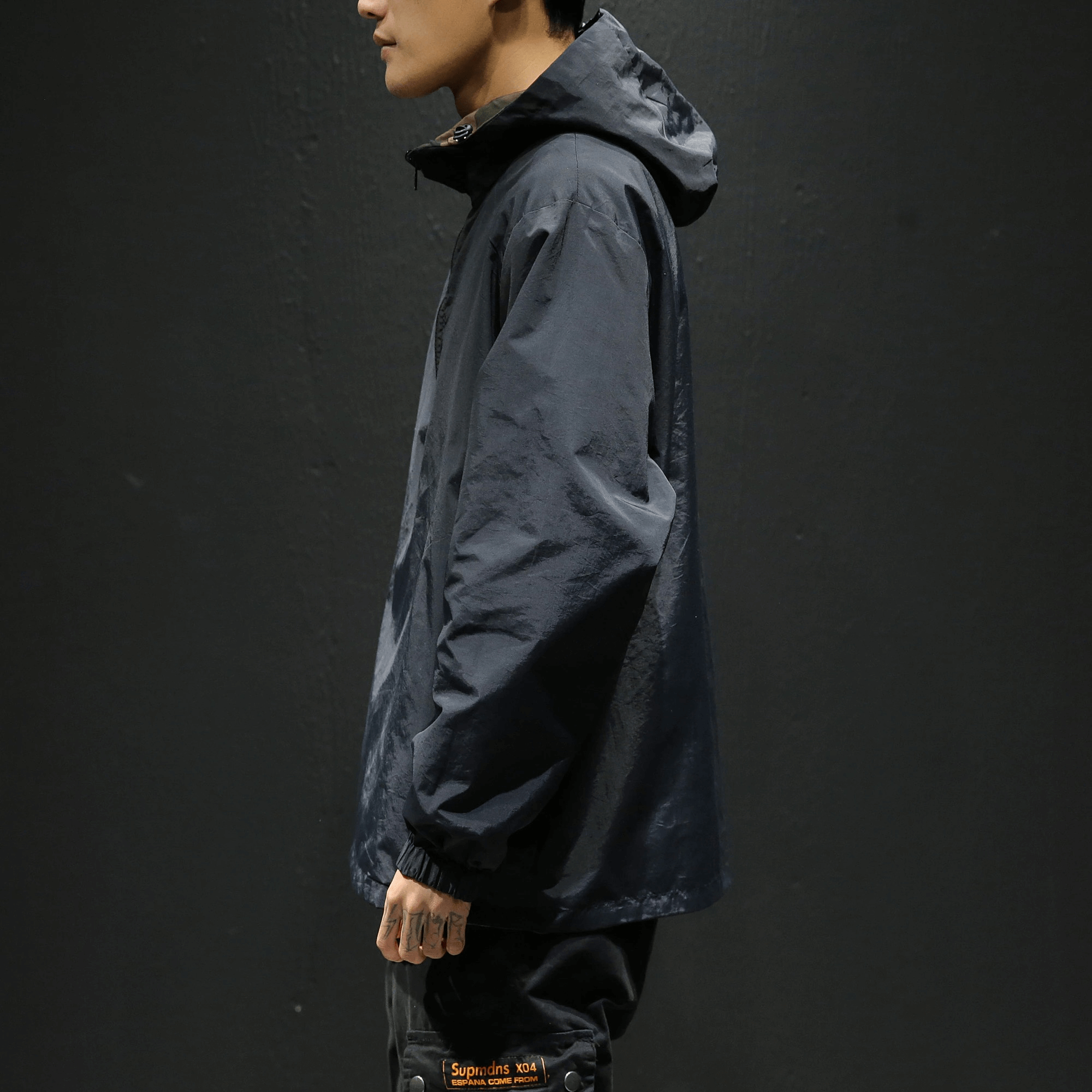 Stylish men’s loose-fitting navy hoodie with a hood, perfect for casual outings.