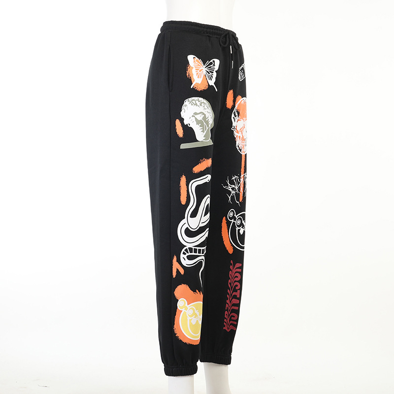 Casual loose pants for women featuring cool graffiti prints in black with vibrant designs, ideal for relaxed style.