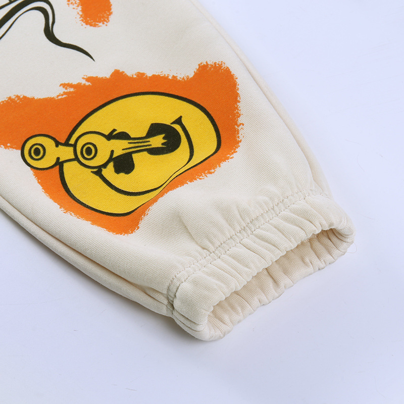 Close-up of casual loose pants for women featuring a cool graffiti design and elastic cuff.