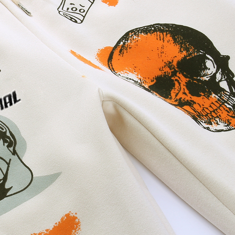 Close-up of casual loose women's pants featuring cool graffiti designs, including a skull and artistic motifs.