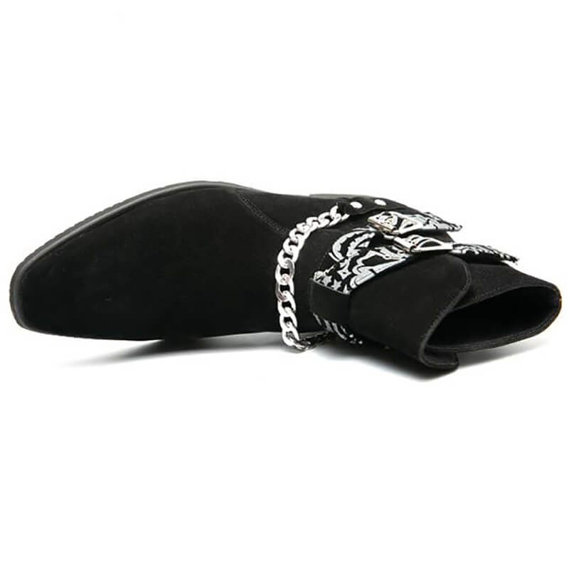 Stylish black faux suede ankle boots with buckle strap and chain detail, perfect for casual fashion.