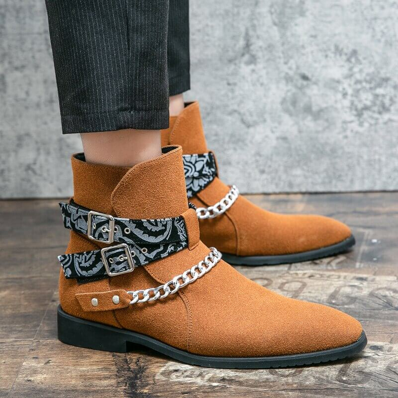 Men's casual faux suede ankle boots in brown, featuring buckle straps and chain detail for stylish comfort.
