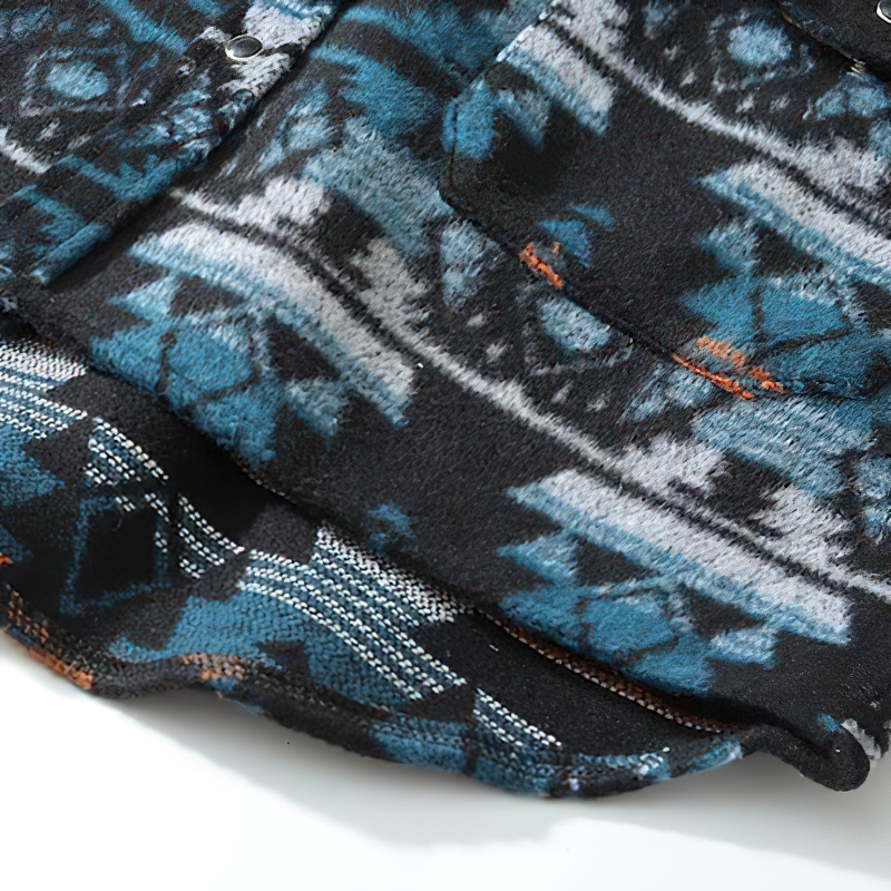 Close-up of a trendy men's geometric graphic print shirt in blue and black with a retro design and full sleeves.