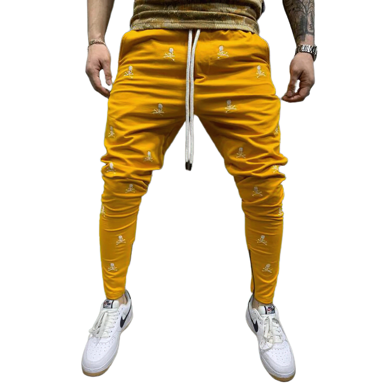 Men's yellow lace-up pants with skull print, perfect for casual style and ultimate comfort.