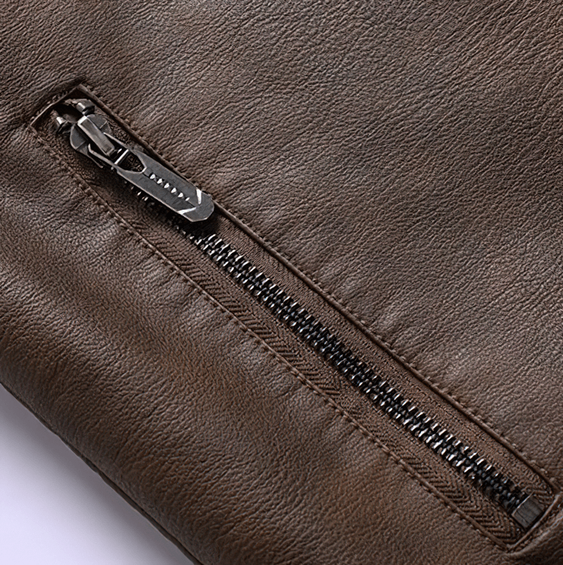 Close-up of the stylish zipper detail on a brown faux leather motorcycle jacket for men.