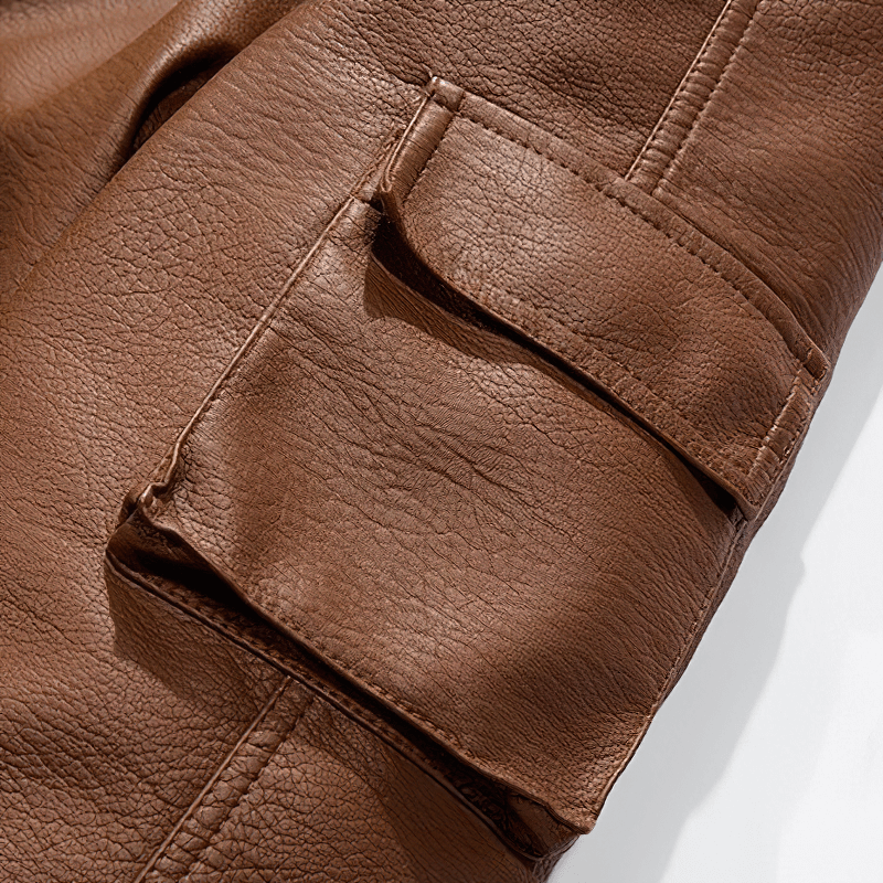 Close-up of brown PU leather jacket showing detailed pocket design, perfect for stylish motorcycle wear.