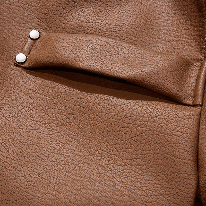 Close-up of brown PU leather texture with snap buttons on a men's motorcycle jacket.