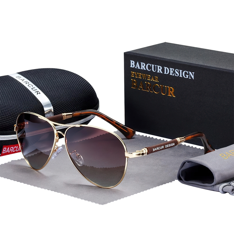Stylish unisex polarized gradient sunglasses by Barcur in a chic packaging with a protective case and cleaning cloth.