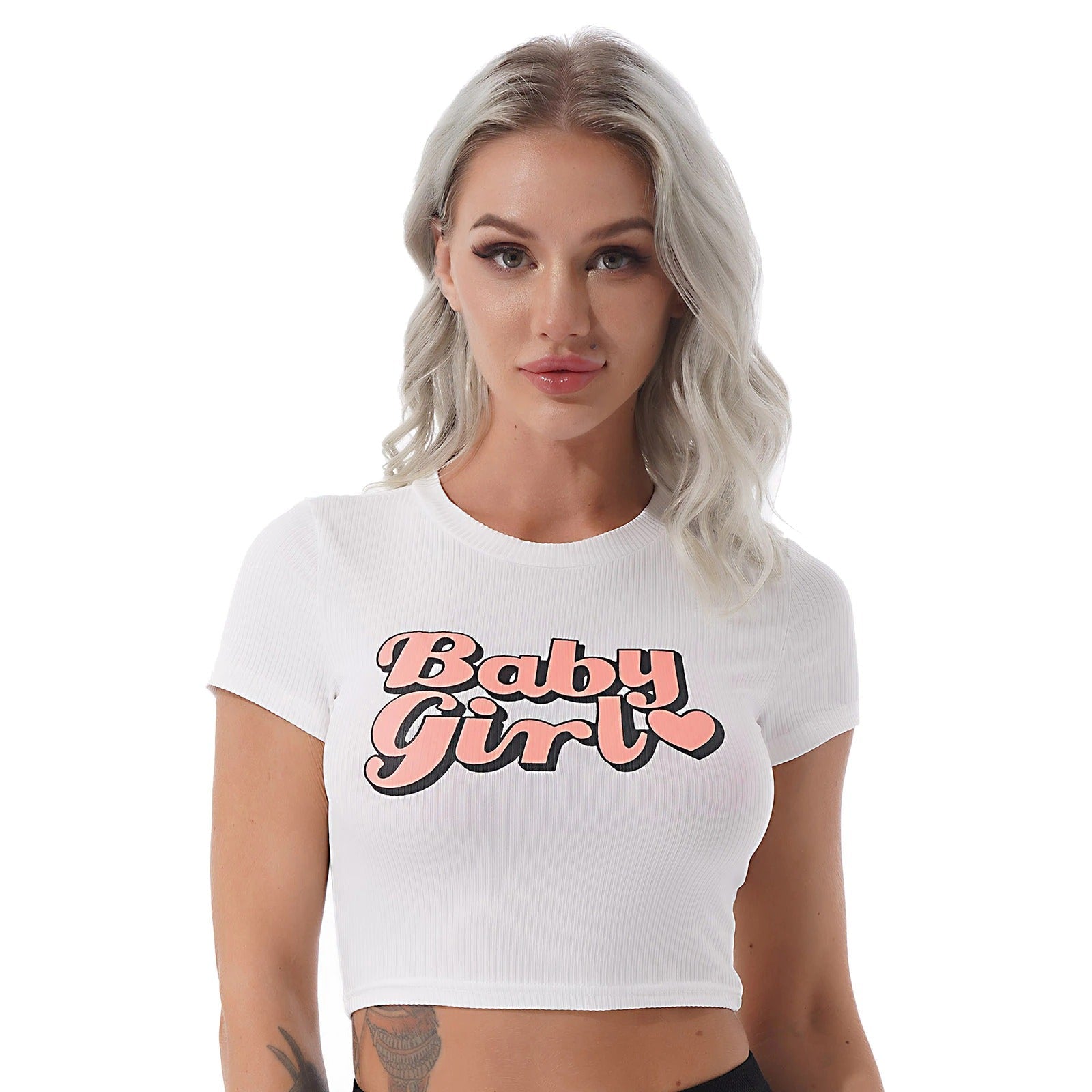 Chic white crop top featuring 'Baby Girl' graphic, perfect for summer streetwear and casual fashion looks.