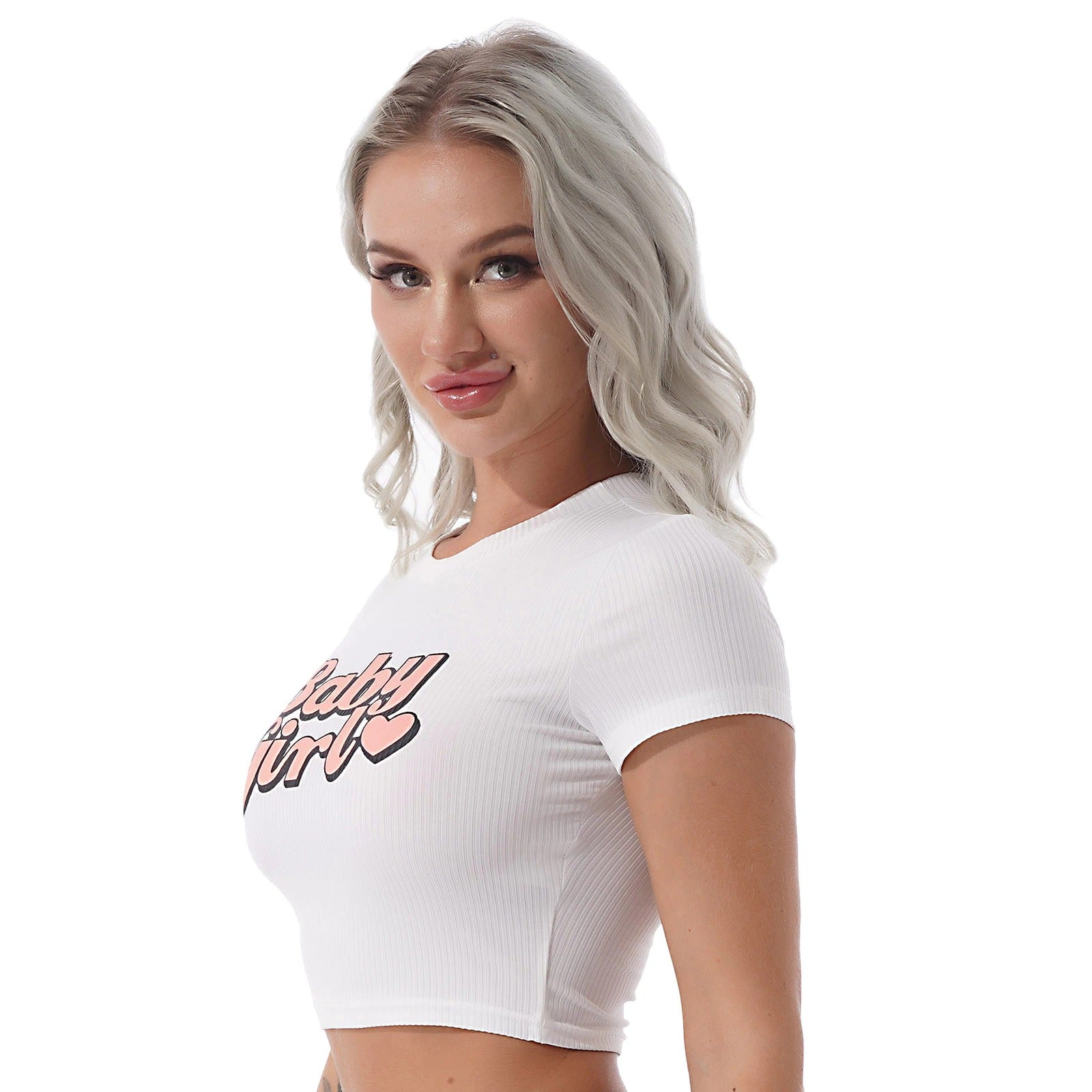 Model wearing a white cropped T-shirt with 'Baby Girl' print, showcasing summer streetwear style.
