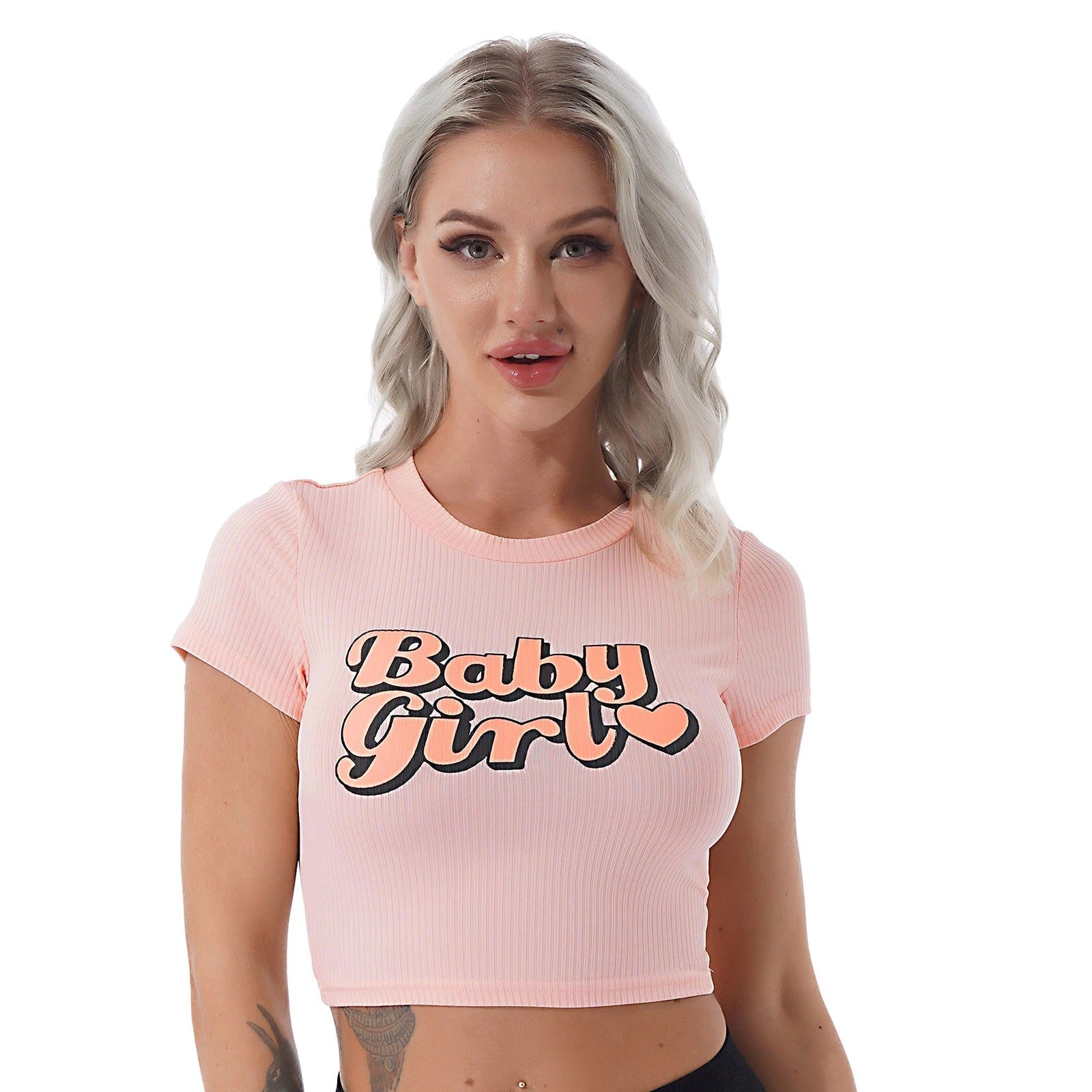 Model wearing a pink casual slim t-shirt with 'Baby Girl' print, perfect for summer streetwear style.