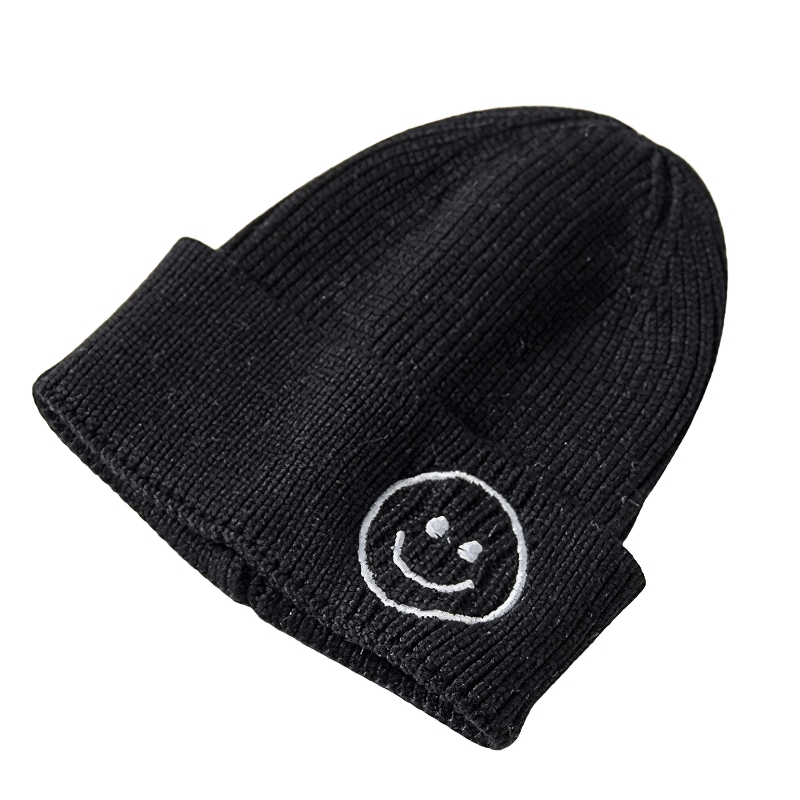 Casual black knitted hat with a smiley face print, perfect unisex accessory for warmth and style.