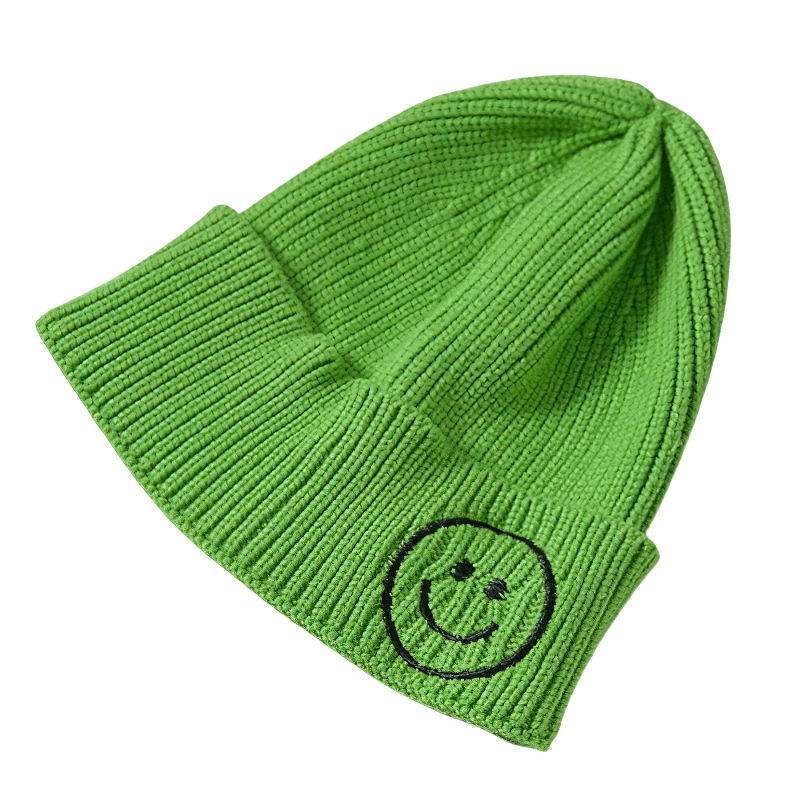 Unisex green knitted hat with smiley face print, a warm casual accessory for men and women.