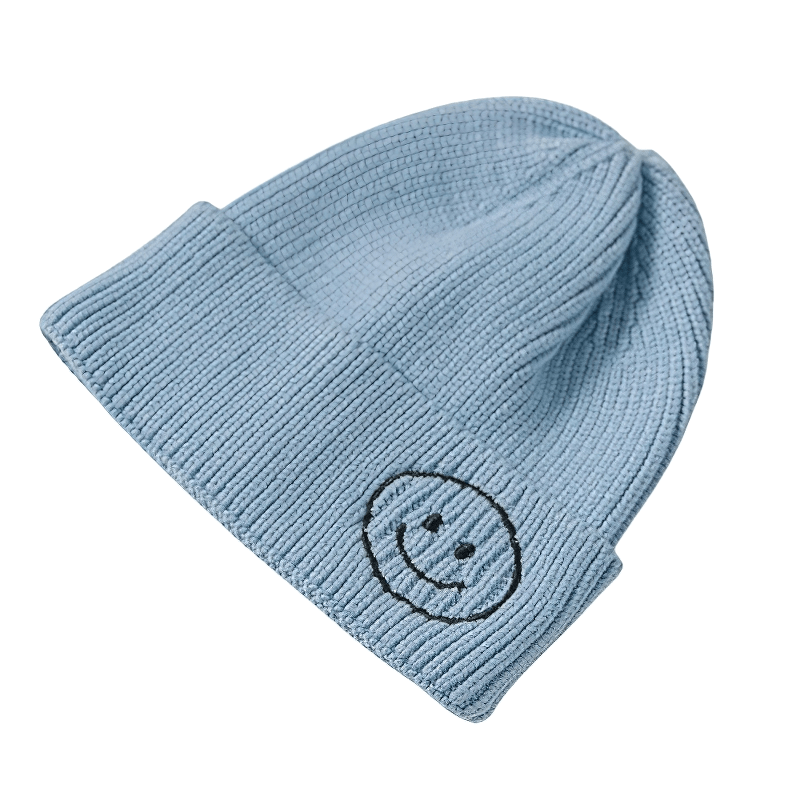 Casual blue knitted hat with smile print, warm accessory for unisex fashion lovers.