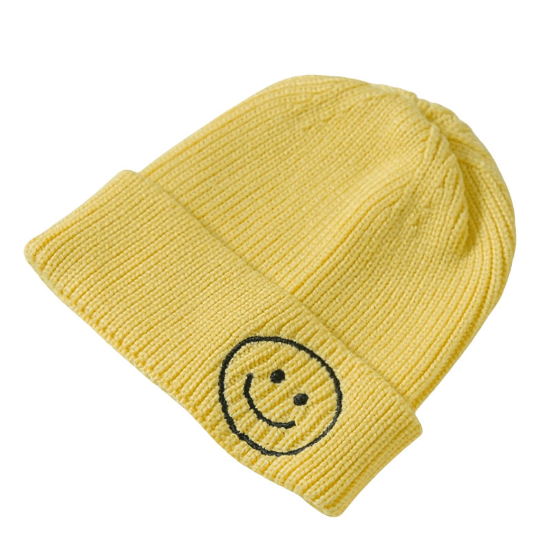 Casual yellow knitted hat with a smiley face print, perfect warm accessory for men and women.