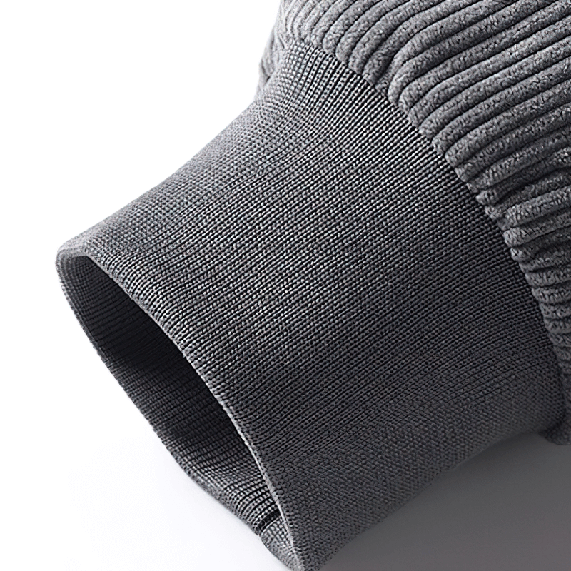 Close-up of gray corduroy jacket sleeve showcasing textured fabric and smooth finish.