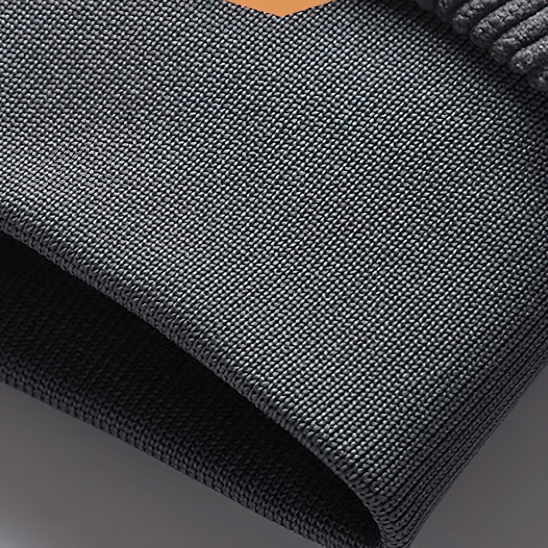 Close-up of the textured material of a casual black corduroy jacket with a fur collar for men.