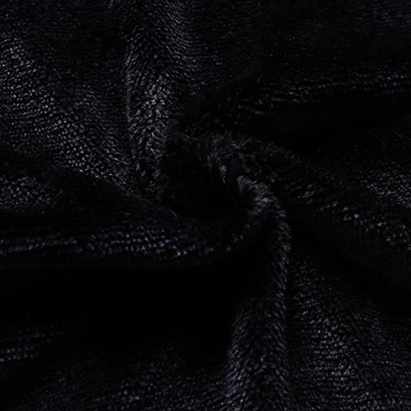 Close-up of soft black fleece fabric showcasing its plush texture for casual jackets.