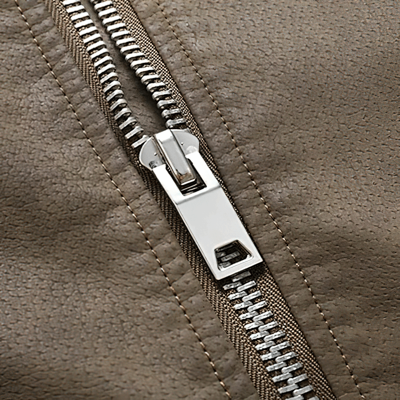Close-up of a zipping detail on a vintage men's soft faux leather jacket, showcasing quality craftsmanship.