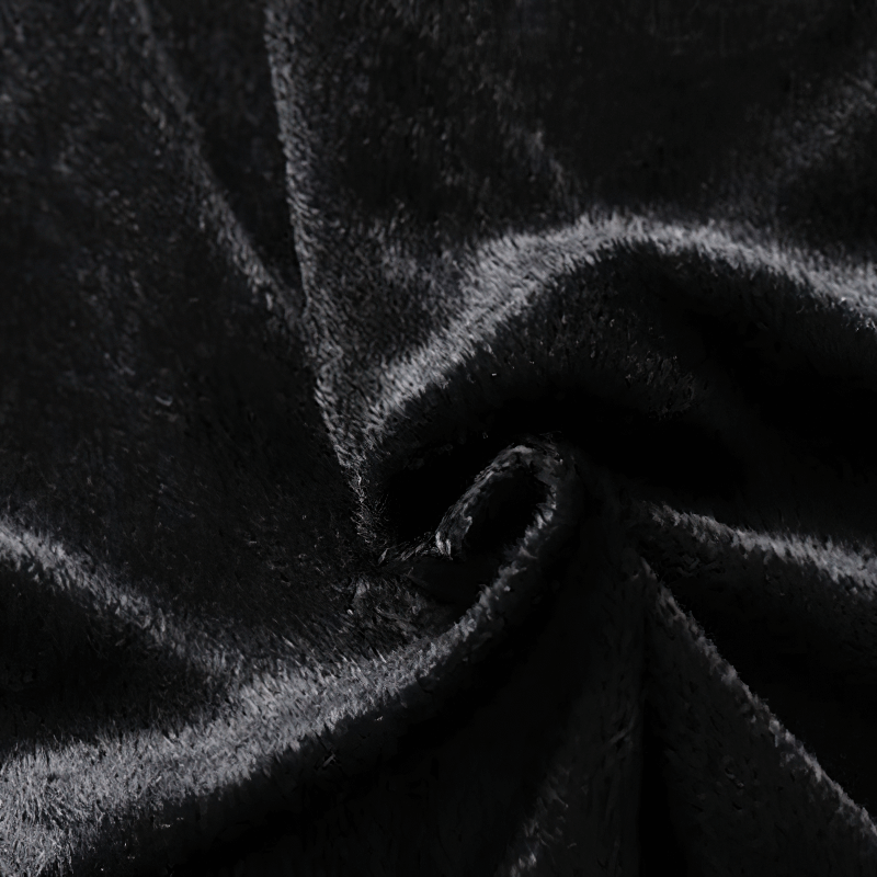 Close-up of soft black fabric showcasing the luxurious texture, perfect for stylish clothing designs.
