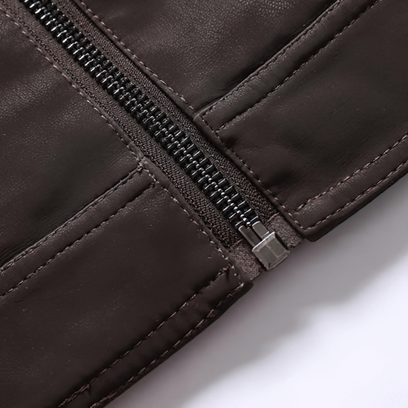 Close-up of a zipper on a men's PU leather motorcycle jacket with multi-pocket design.