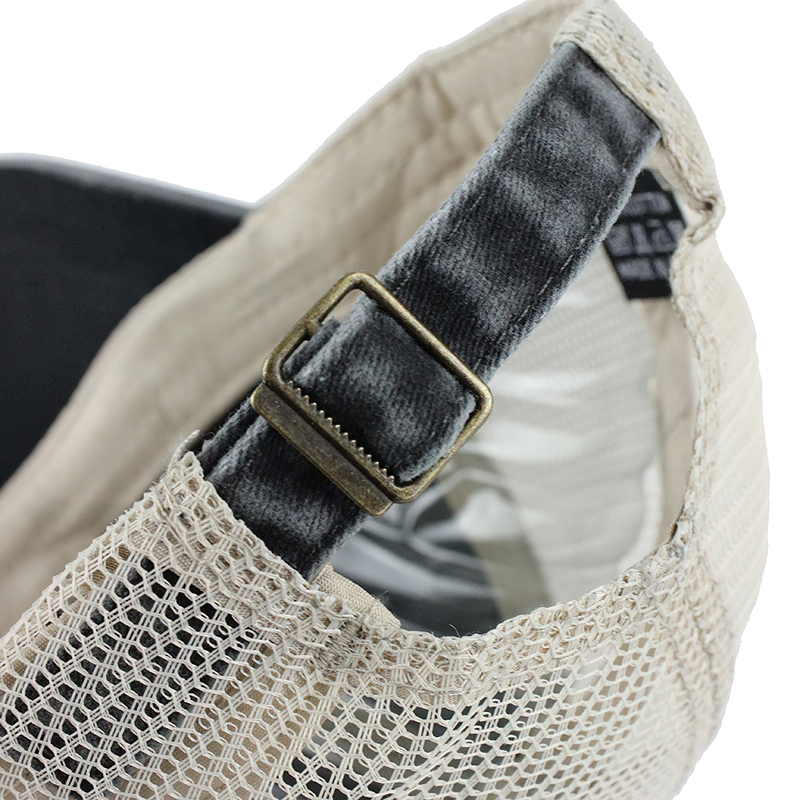 Close-up of adjustable buckle and mesh design on a stylish unisex baseball cap.
