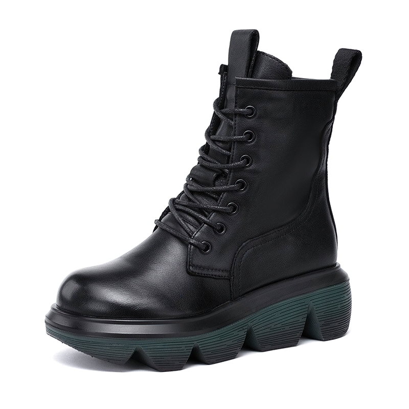 Stylish women's black genuine leather boots with thick rubber soles for casual wear.