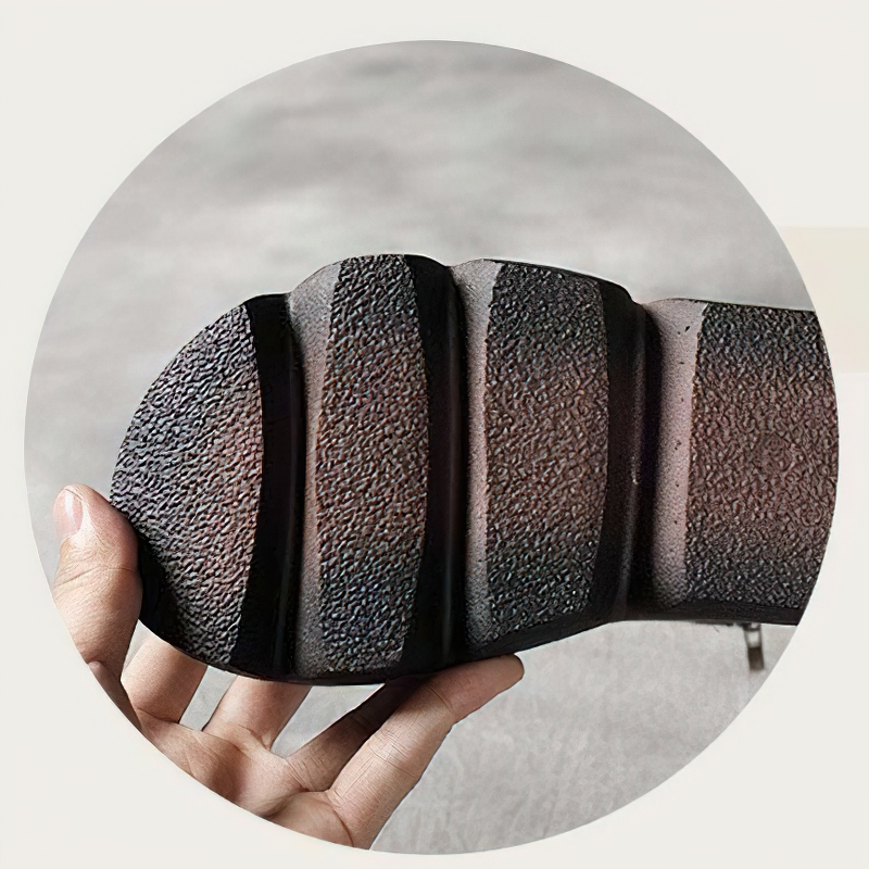 Close-up of a thick-soled rubber boot sole, showcasing its textured design and durability for stylish comfort.