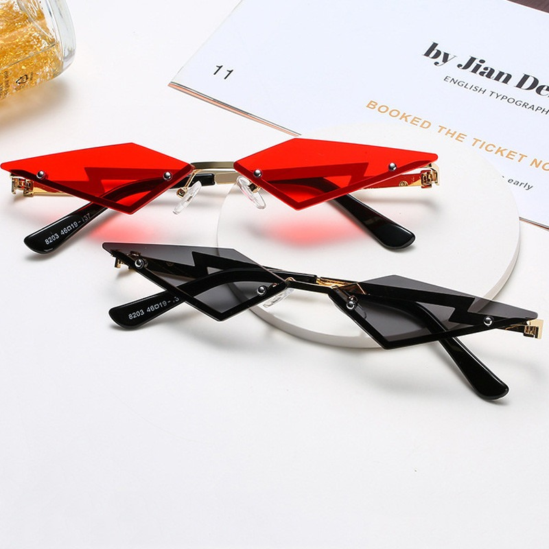 Unisex rimless cat eye sunglasses in red and black, a trendy vintage punk accessory for stylish looks.