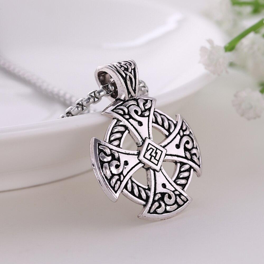 Celtic Cross Shield Pendant Necklace in silver, Viking style jewelry with intricate designs on a chain.