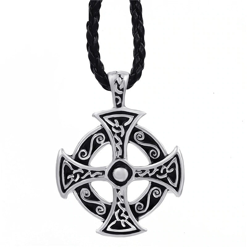 Celtic solar cross pendant necklace in zinc pewter with intricate design on a braided cord.