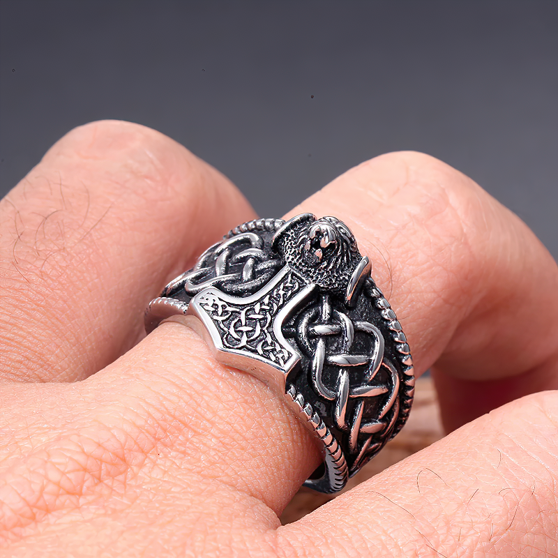 Celtic Thor's Hammer Nordic Ring on a finger, featuring intricate silver designs and detailing, perfect for unisex rock style.