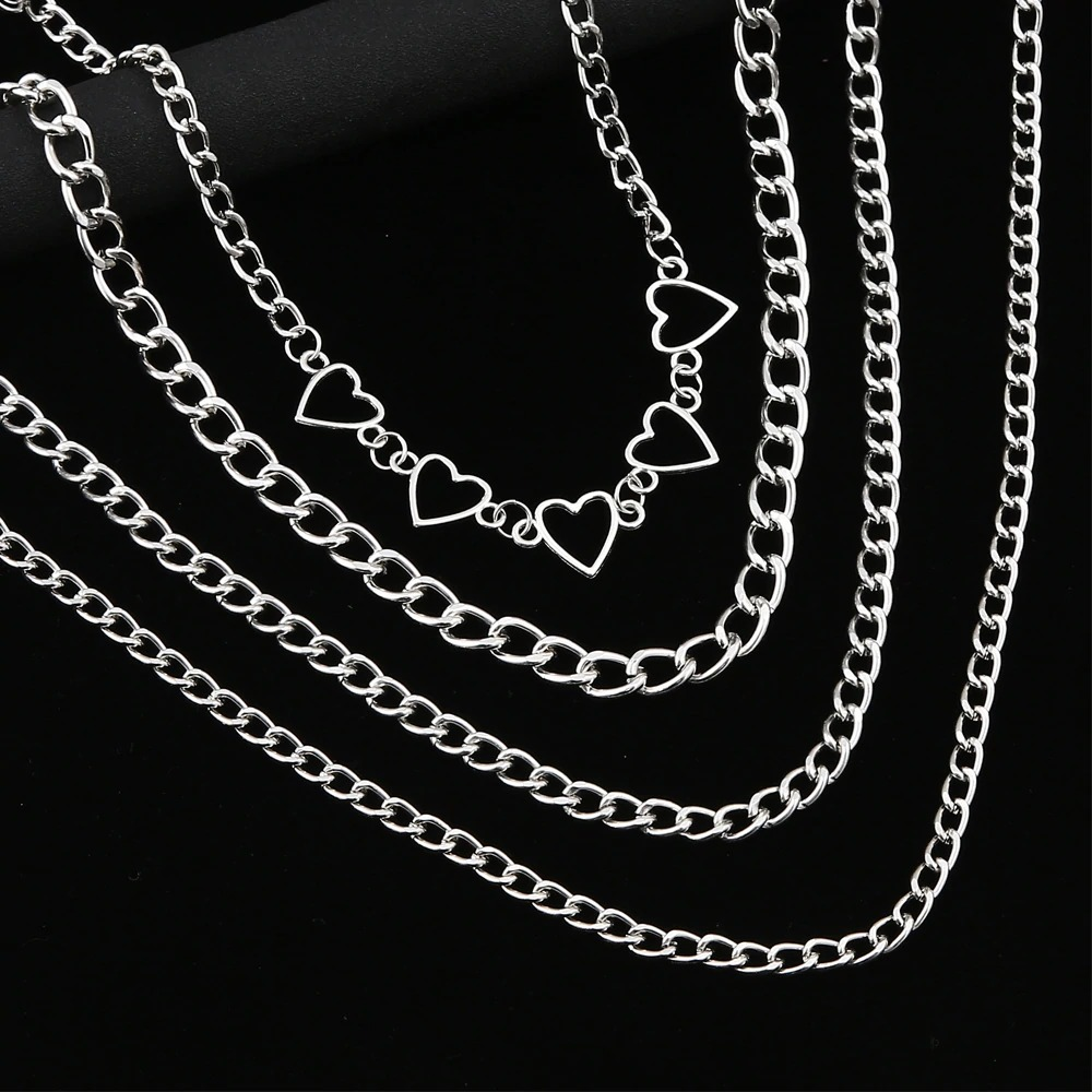 Layered silver chain necklace with heart embellishments, perfect for women's fashion and aesthetic styling.
