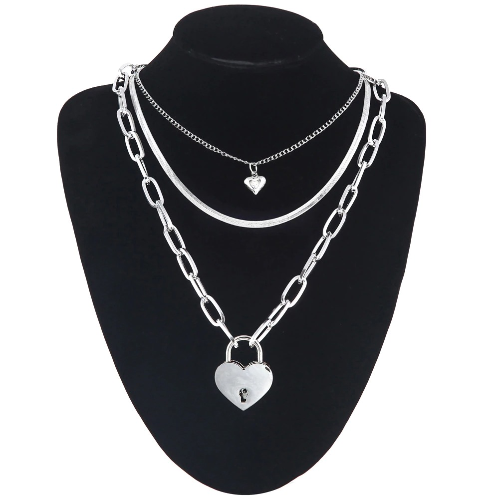 Layered chain necklace with heart pendant for women, perfect for a trendy fashion aesthetic.