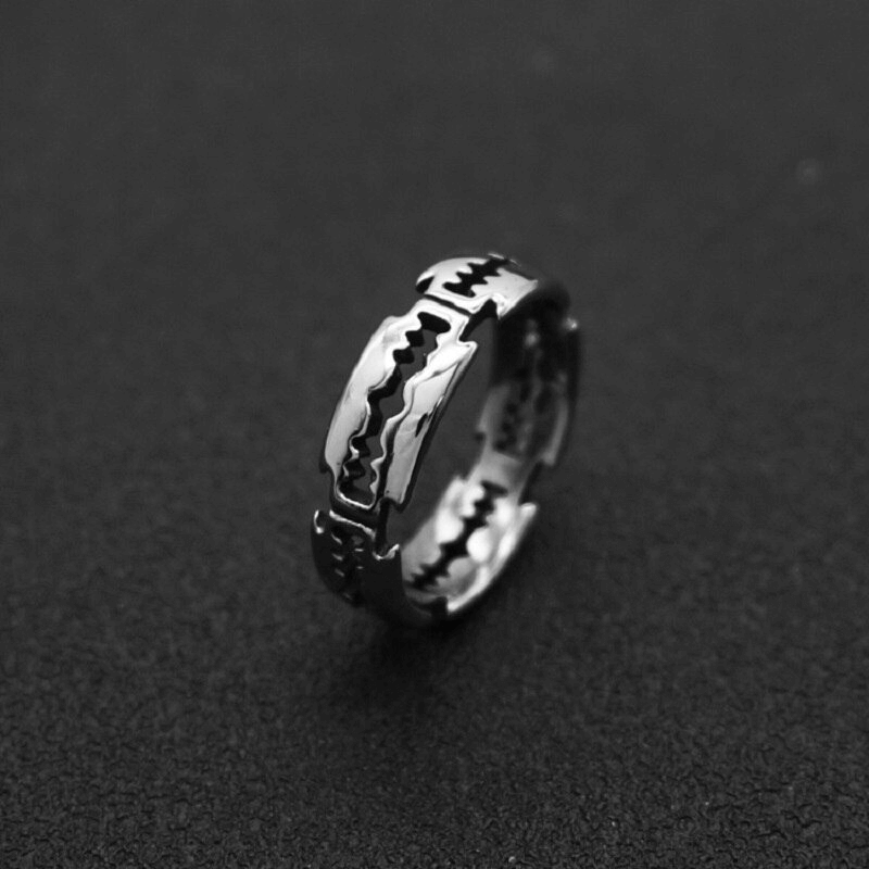 Unisex stainless steel bladed ring in punk rock style, perfect accessory for men and women.